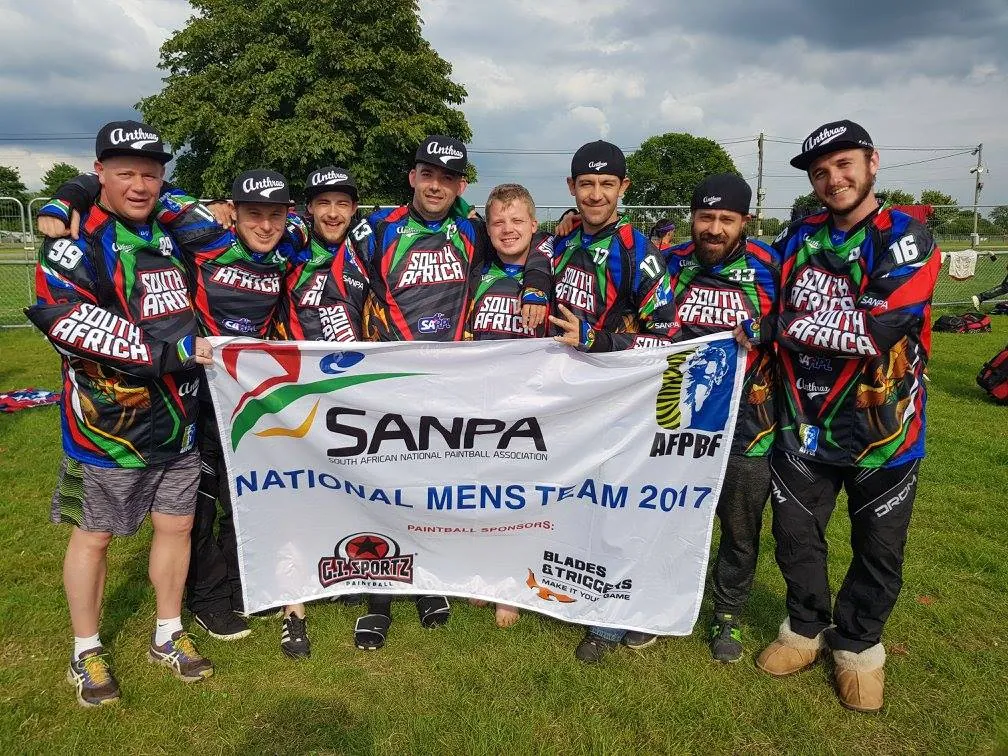 The South African Men's team holding the SANPA National Men's Team 2017 banner at the world cup