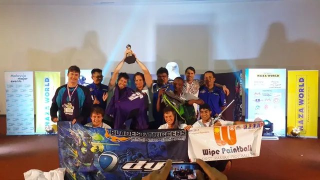 Team Dynamix celebrating with the Division 1 trophy at the Naza World Cup Asia 2013