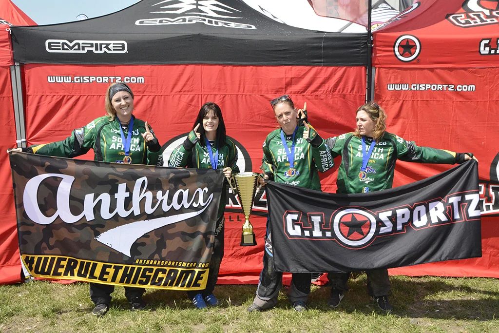 The South African women's paintball team holding the trophy and medals at the 2018 UPBF Women's World Championship