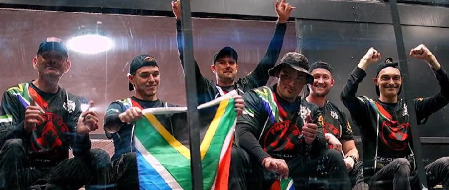 Airsoft players in South African colours holding the national flag