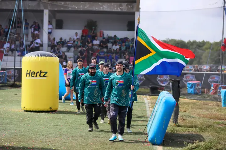 The flag flying over the South African team entering the field