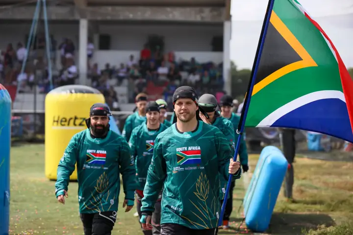 South African flag bearer leading the team onto the field