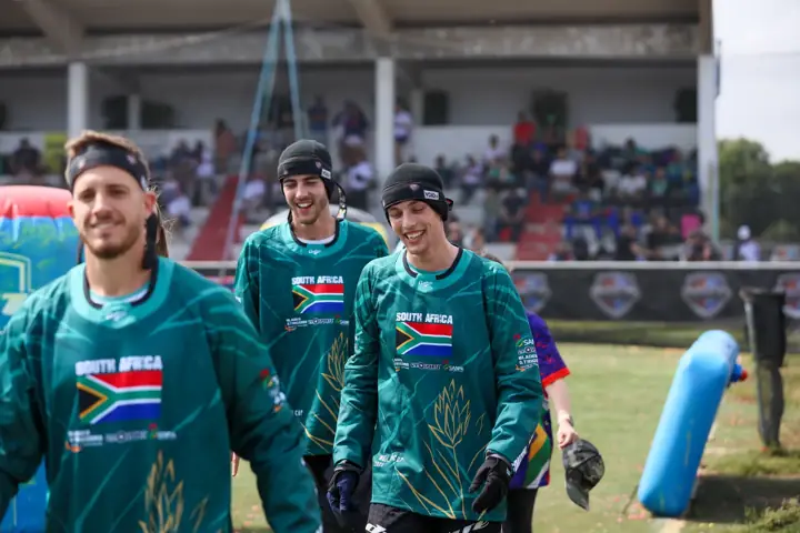 Three South African players smiling during the walk-out