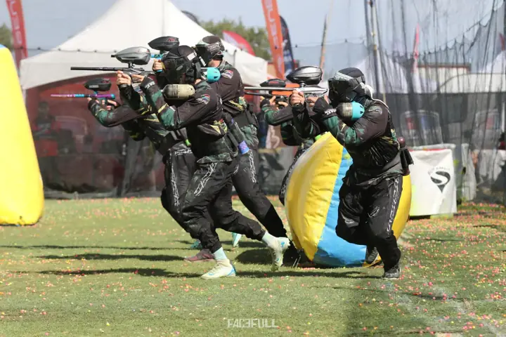 South African players advancing together past a bunker