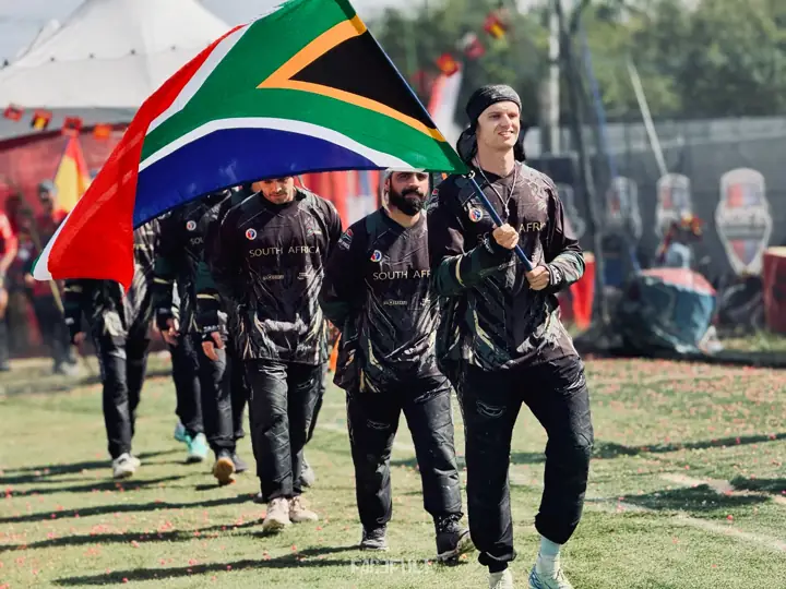 South African team walking onto the field behind the flag