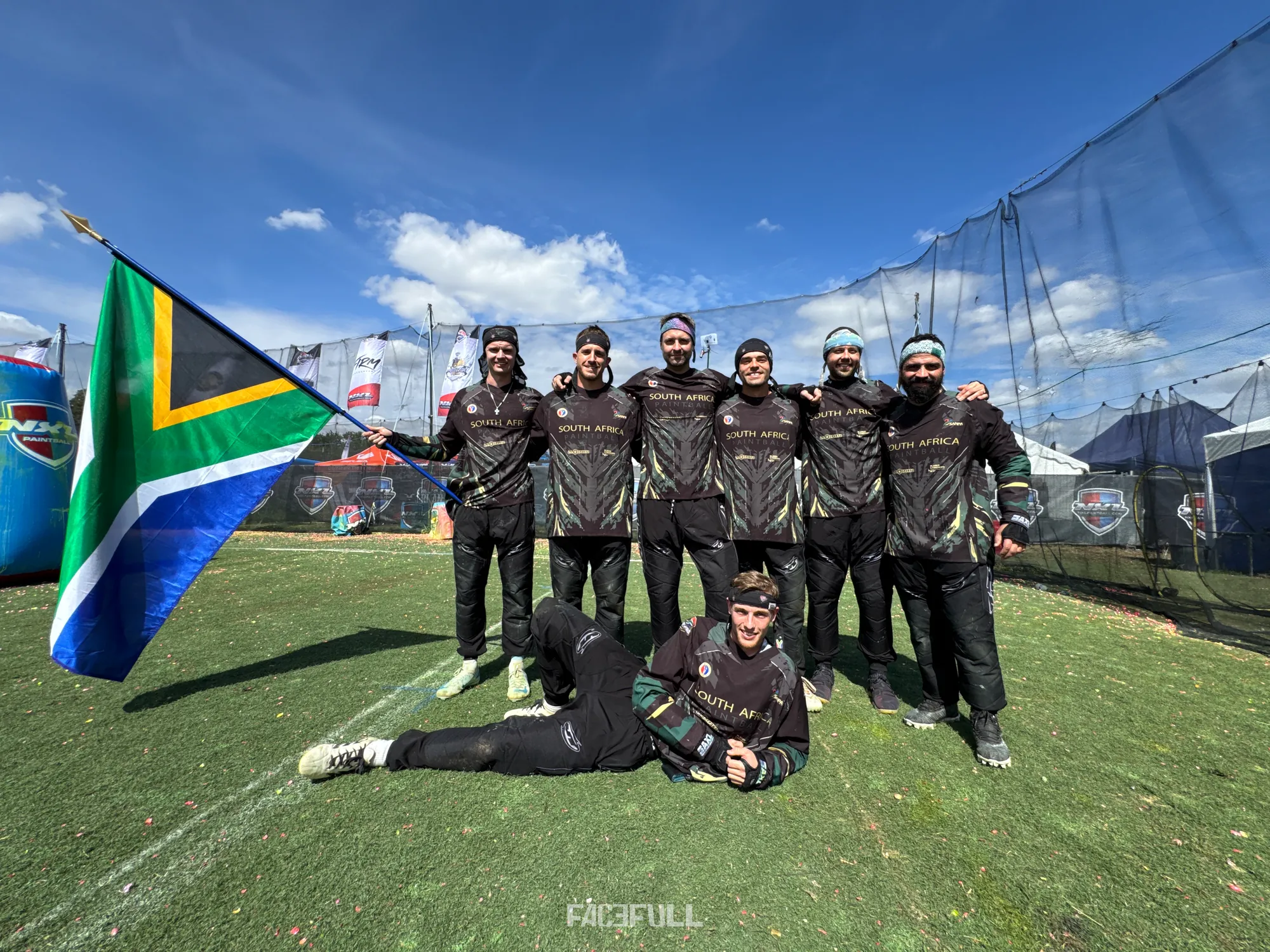 The South African team gathered around the national flag at the UPBF Paintball World Championship